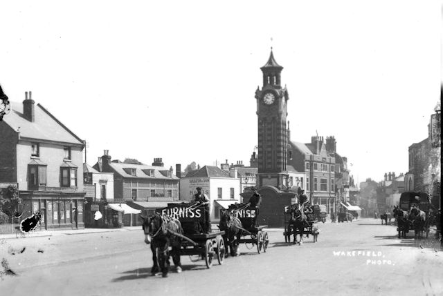 Furniss coal carts in Epsom High Street.
