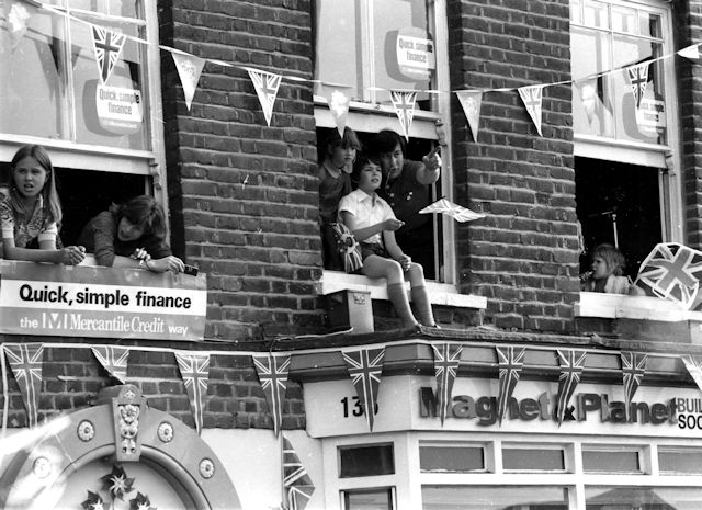 Children watching the Queen Elizabeth's visit from Magnet & Planet Building Society. Children watching the Queen Elizabeth's visit from Magnet & Planet Building Society.