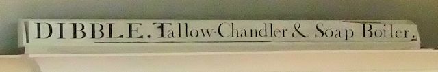 A painted beam from Dibble the tallow chandlers, now in Bourne Hall Museum