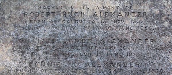 Memorial inscription to Robert Hugh, William James and Annie Isabella Alexander on the family grave.