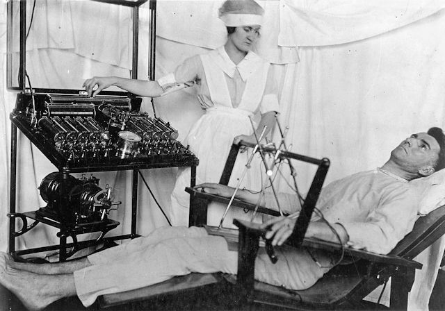 A shell-shocked soldier receives treatment from a nurse