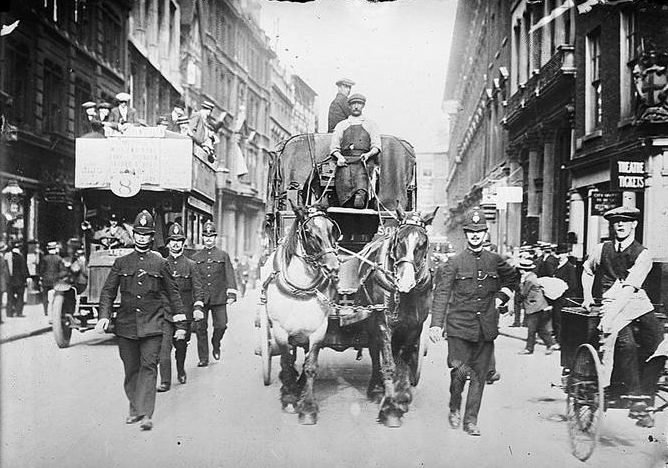 Police escorting a supply truck during the General Strike
