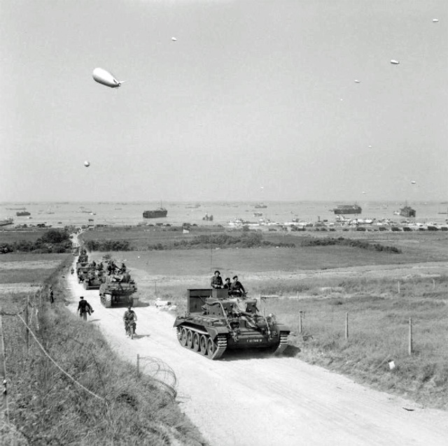 Tanks from the 4th County of London Yeomanry moving inland from Gold Beach, 7 June 1944.