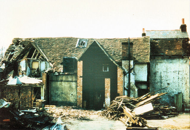 Nuttalls' shop on Cheam Road, with early nineteenth-century bay windows at the front and the old house behind.