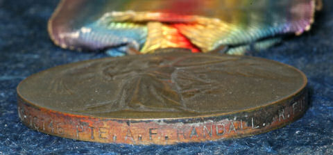 The inscription on Arthur's medal. The inscription on Arthur's medal.
