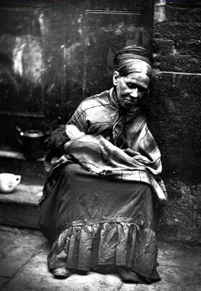 A Destitute woman with child c.1876from London Street Life in Historic by John Thomson