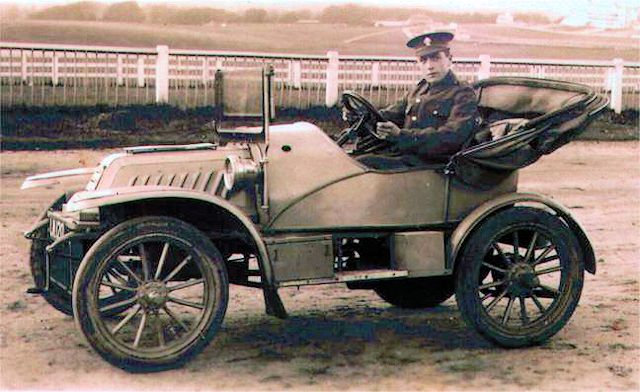 George in uniform driving a car on Epsom Downs George in uniform driving a car on Epsom Downs