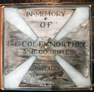 The original grave marker made from a packing case which is now held by Bourne Hall Museum.