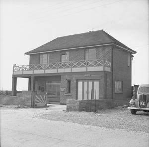 A house on the south coast of England, requisitioned by the British Army, and used to house pumping equipment.